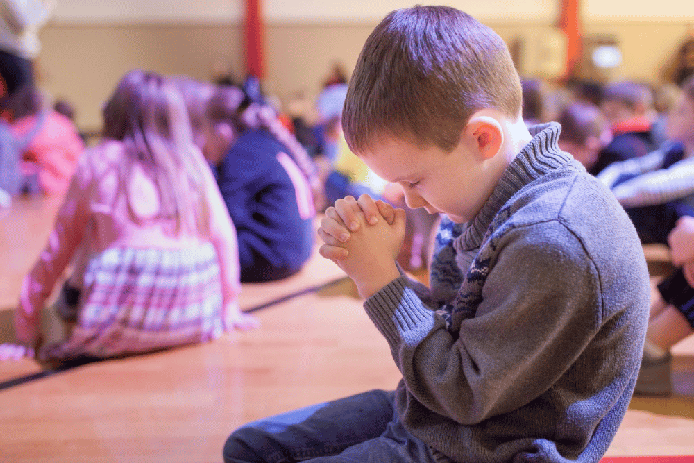 A young West Hills student is taking a moment for prayer.