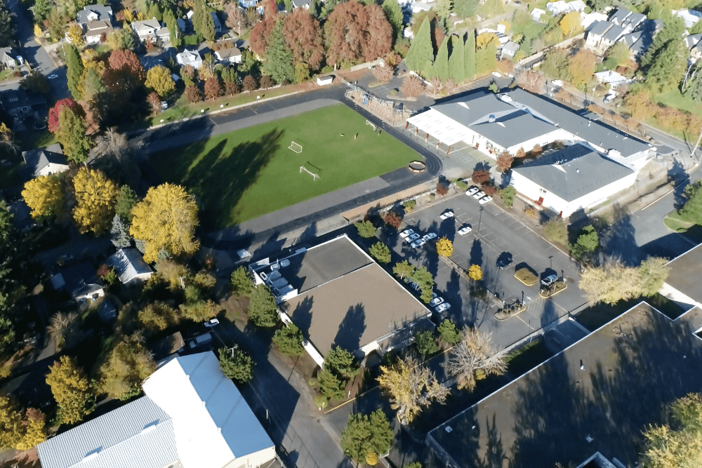 Arial shot of West Hills Christian School grounds including multiple buildings and the athletic field.
